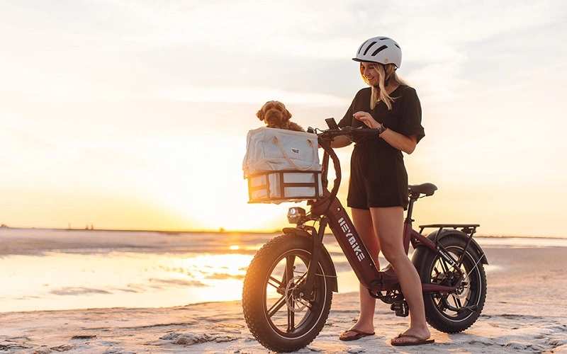 A girl standing with Electric Bike