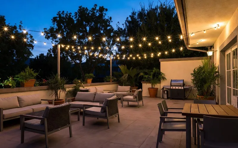 Well-designed patio with comfortable seating, dining area, and outdoor lighting for family gatherings